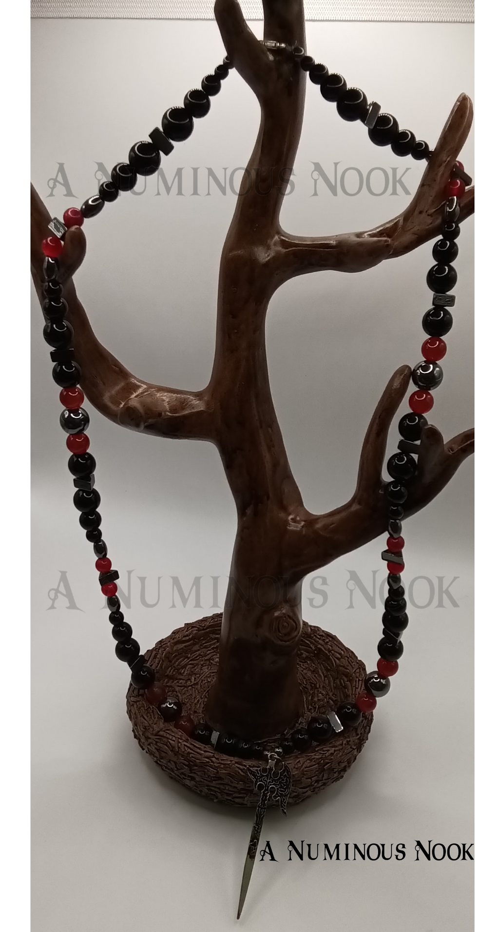 Carnelian, onyx, and hematite axe necklace
