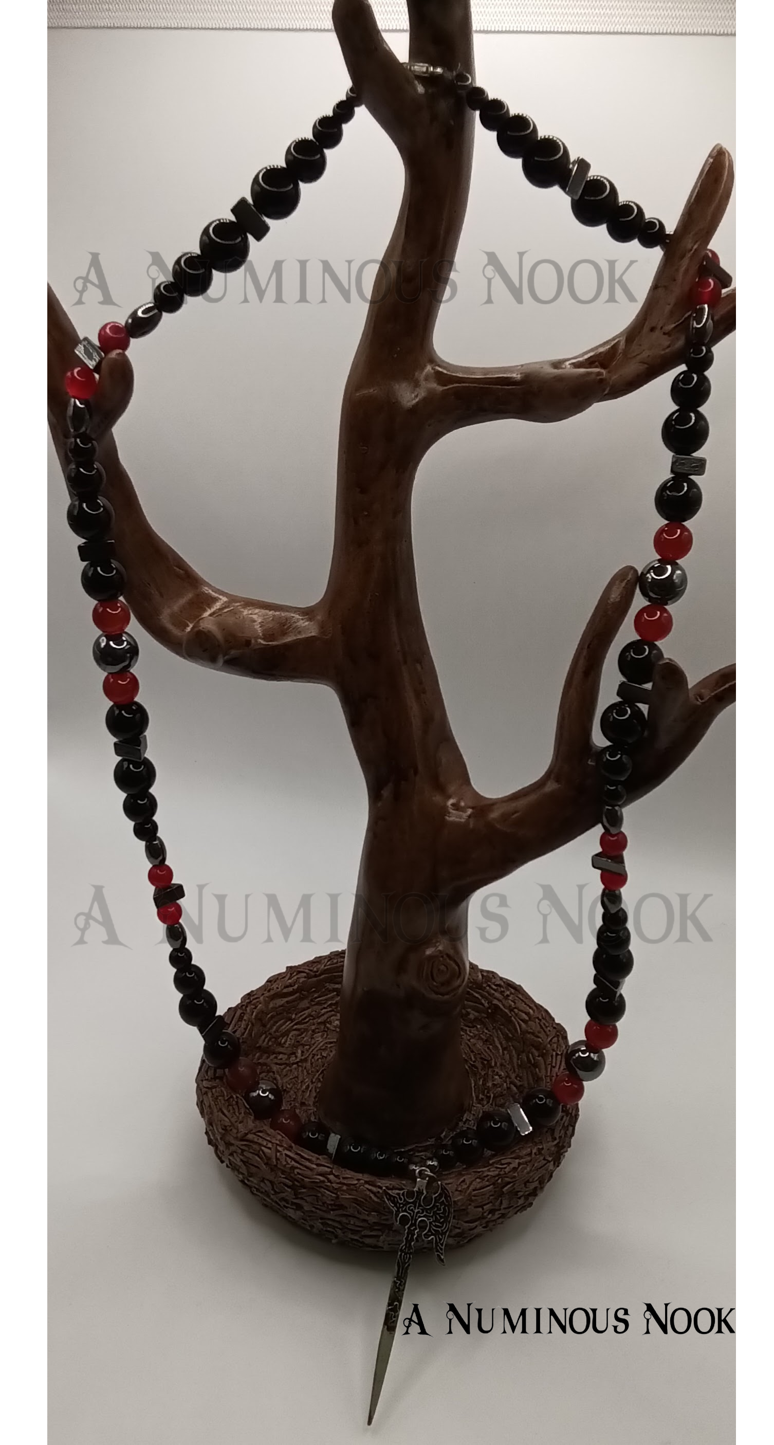 Carnelian, onyx, and hematite axe necklace