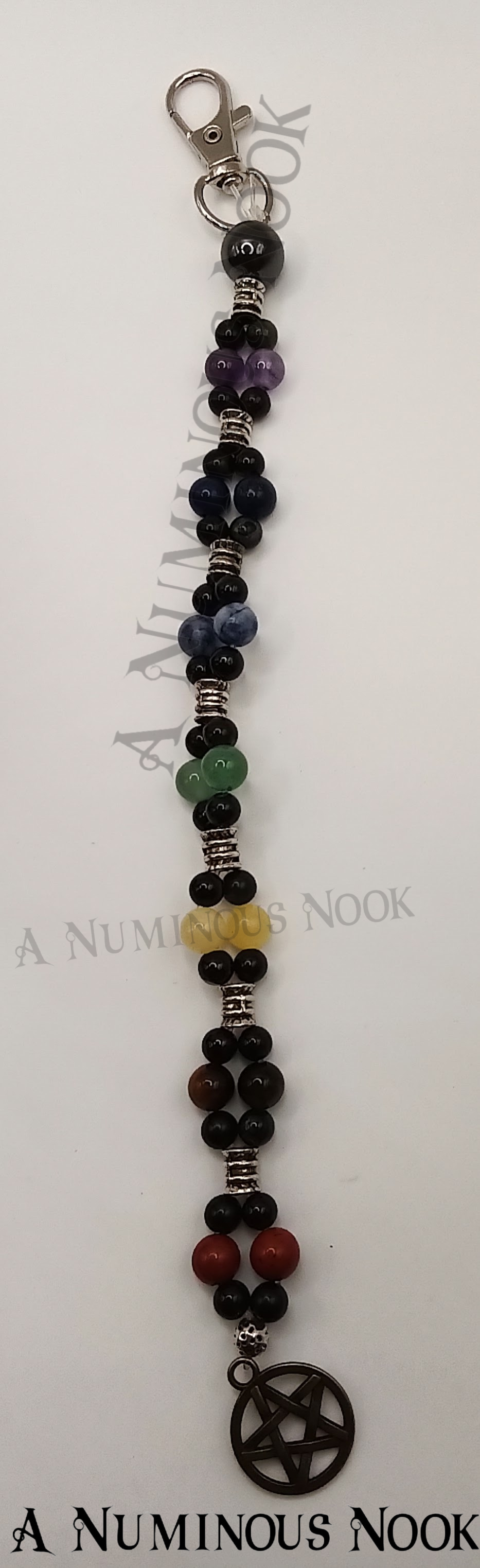Silver star with circle around charm chakra clip
