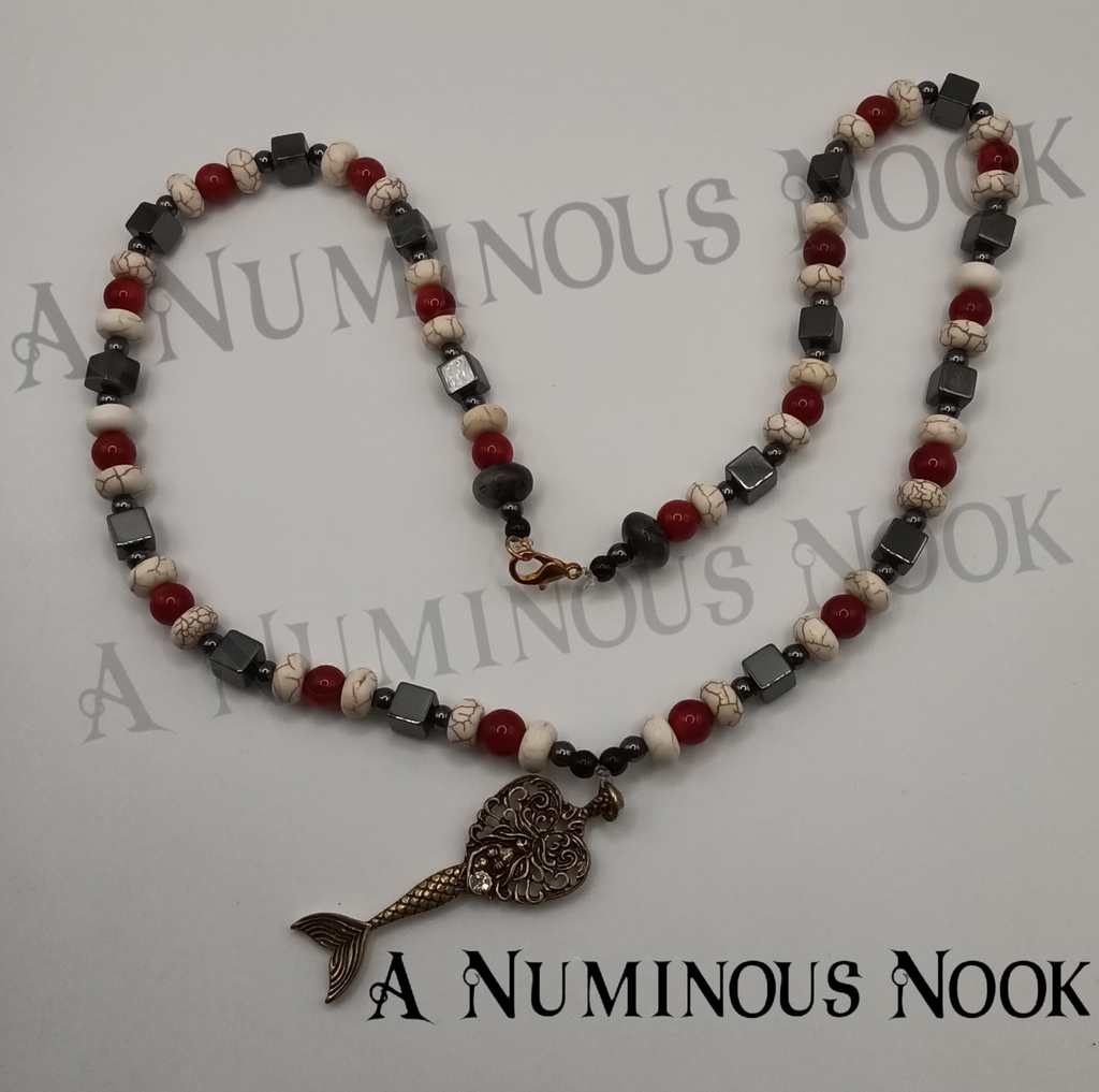 Hematite, red coral, and white howlite mermaid necklace