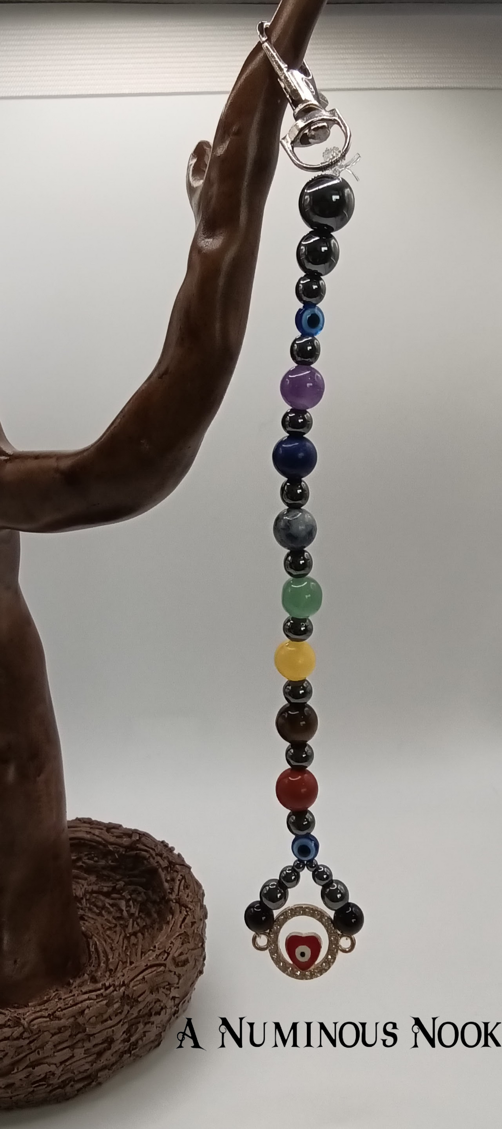 Red evil eye chakra clip