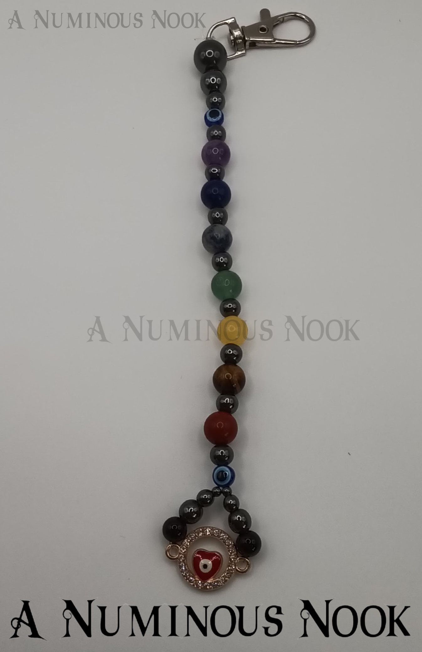 Red evil eye chakra clip
