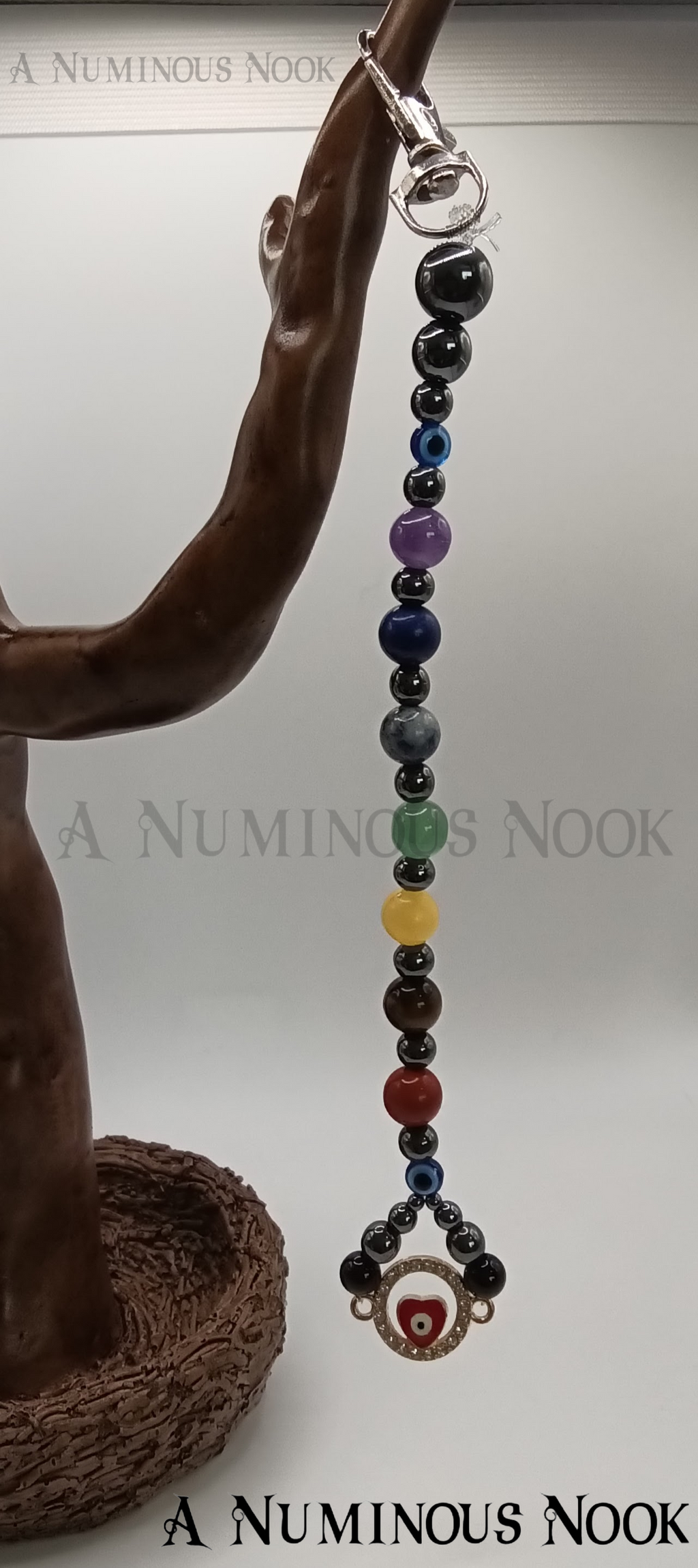 Red evil eye chakra clip