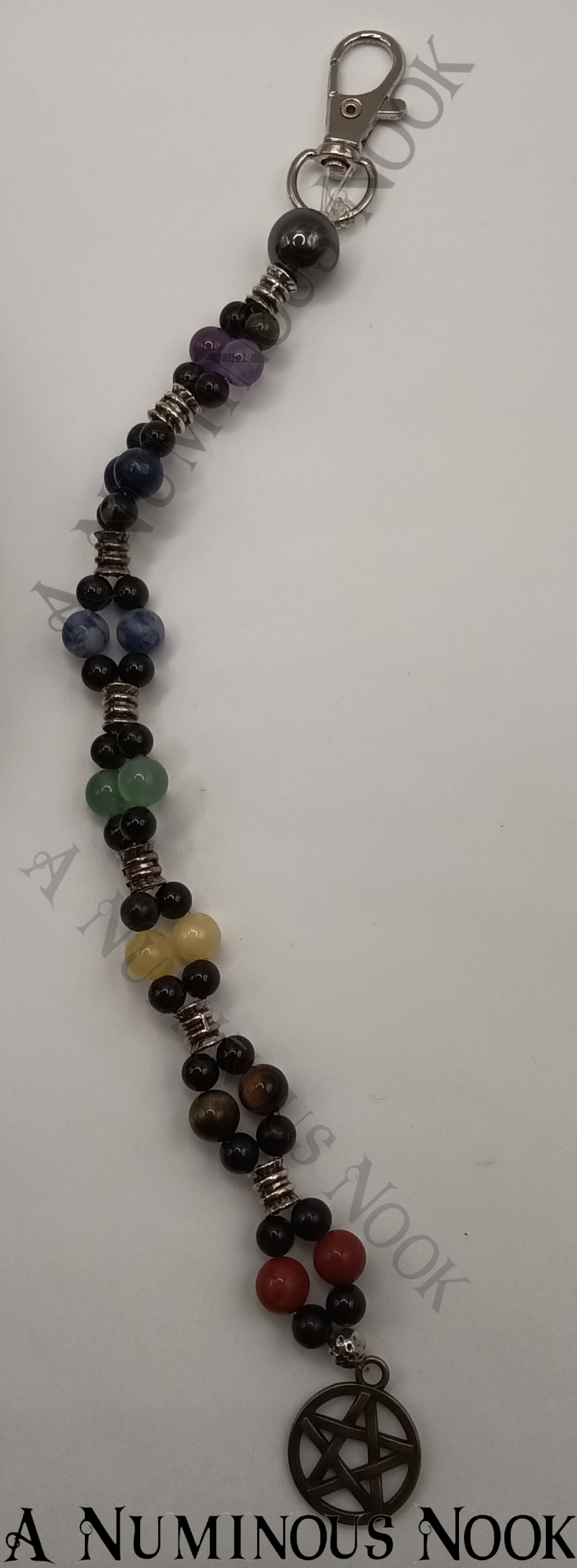 Silver star with circle around charm chakra clip